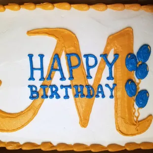 a cake with the letter m on it