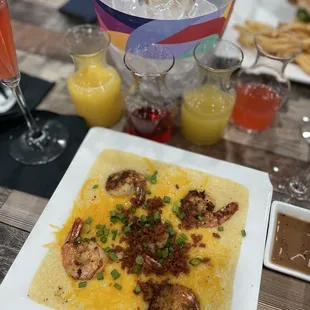 Shrimp and grits with our bottomless mimosas.