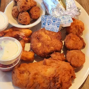 FRIED COMBO PLATTER, SCALLOPS, COD, SHRIMP, CRAB CAKE HUSH PUPPIES &amp; BAKED POTATO