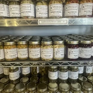 a shelf full of canned food