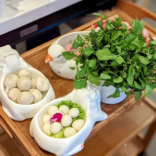 a wooden tray with food on it