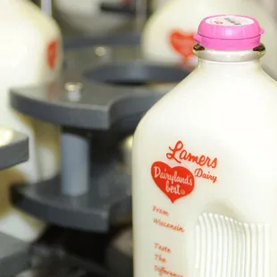 a bottle of milk on a conveyor belt