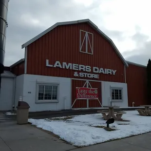 a red barn with a sign that says lamers dairy