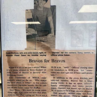 a picture of a woman sitting at a table