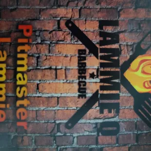 a brick wall with a grill on it