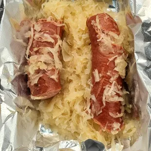 two hot dogs in foil