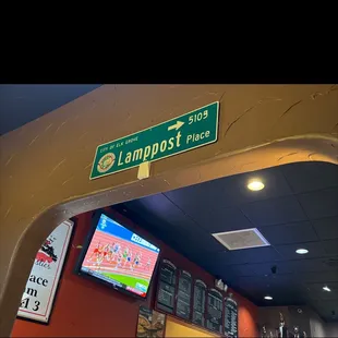 street sign for lamppost place