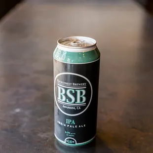 a can of beer on a table