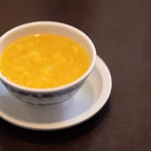a bowl of soup on a saucer