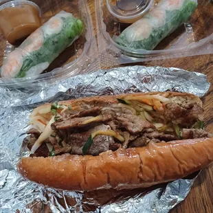 Vietnamese grilled pork sandwich with spring rolls.