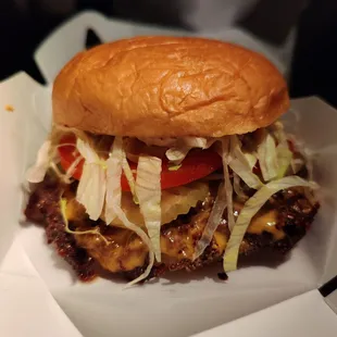 The deluxe, 2 patties x 2 cheese with the veggies and spread. The classic comes without veg and ketchup and mustard instead of spread.