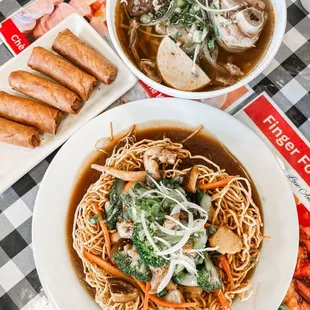 a bowl of noodles and a bowl of soup