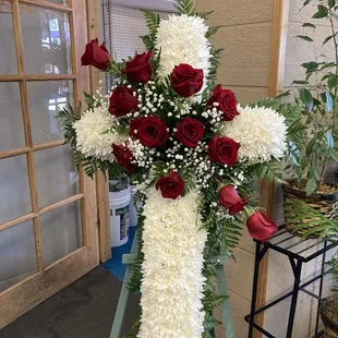 Cross with red spray across it