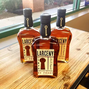 three bottles on a table