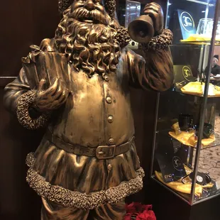 a bronze statue of santa