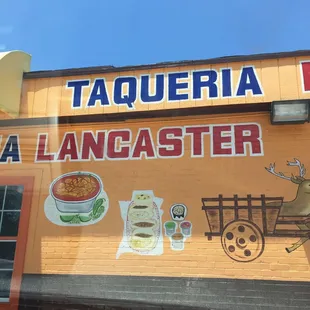 Front entrance and parking lot of Lancaster Taqueria