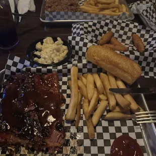 1/2 ribs, fries, garlic toast, and Mac and cheese, 
 Hushpuppies, and pulled pork with fries