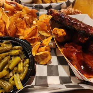 Ribs, wings, green beans, and curly chips