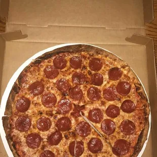 a pepperoni pizza in a box