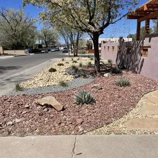Front xeriscape, courtyard wall and new wooden pergola