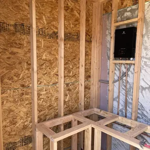 Inside sauna as it was being built including the tankless water heater for the attached shower
