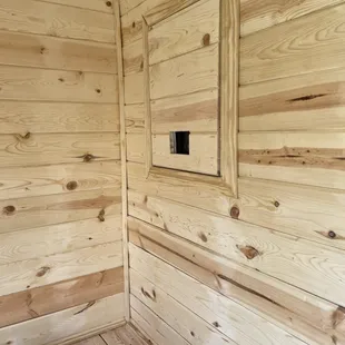 Inside new sauna with tankless water heater access door and open control window (for attached outdoor shower)