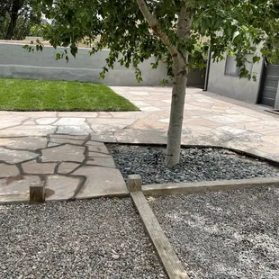 Flagstone nearly finished at drive area, added sod and back patio flagstone