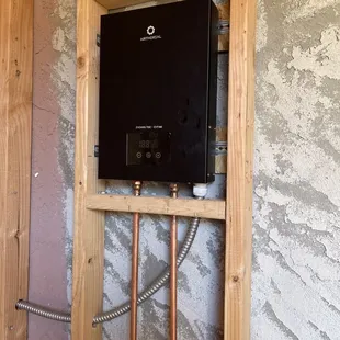 Tankless water heater for attached outdoor shower