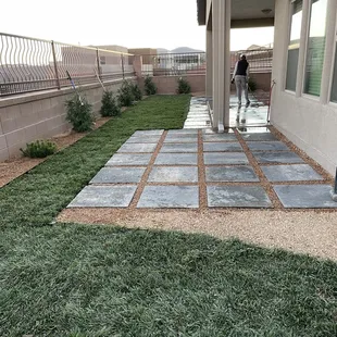 Grass, pavers, gravel, plantings and drip installed using a customer supplied design