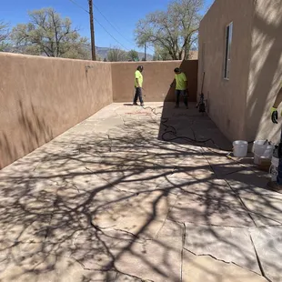 Finishing up flagstone inside courtyard