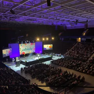 a large auditorium full of people