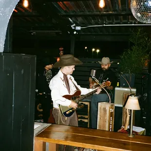 a man playing a guitar