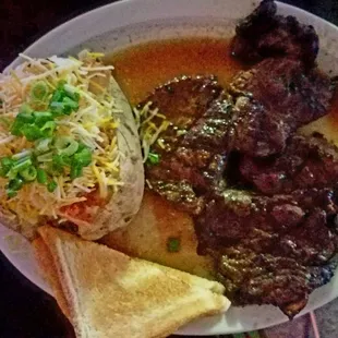 14oz. Ribeye Steak with baked potato, toast and side salad (not pictured) $20.00 well spent.