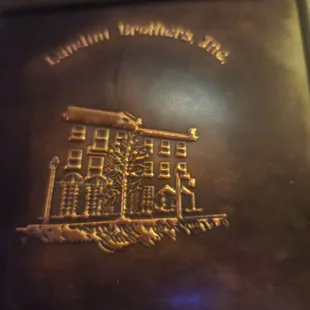 a close up of the logo on the front of the book