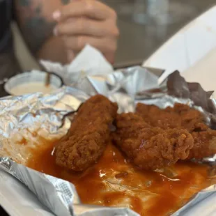 Chicken fingers tossed in Buffalo sauce.