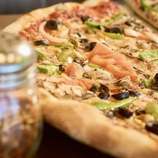 Eating pizza is a lot like a warm hug for your taste buds.