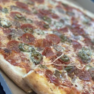 Pepperoni, sausage, and jalapeño pizza.