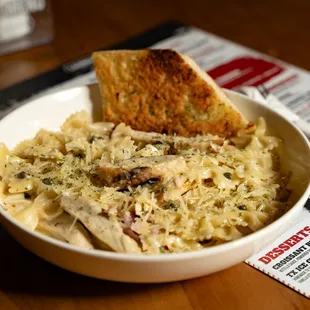 Chicken Piccata - Bowtie Pasta, Seared Chicken Breast, Capers, Garlic &amp; Lemon Butter Sauce served with garlic bread