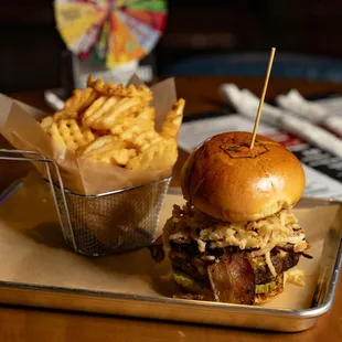 BBQ Brisket Burger - House Smoked Brisket, Aged Cheddar, Crisp Bacon, Onion Strings, Pickles, TX Whiskey BBQ Sauce