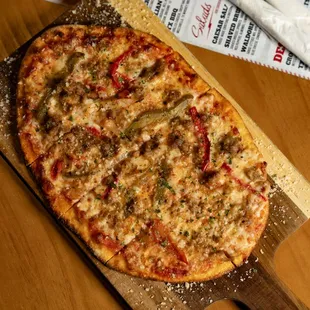 Italian Flatbread loaded with Italian Sausage, Bell Peppers, Mozzarella, Parmesan &amp; Oregano