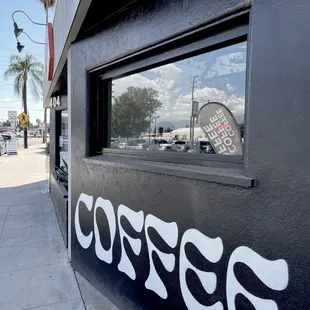 the reflection of a sign in the window