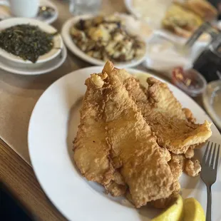 Skinless flounder with calabash shrimp, spinach and home fries.
