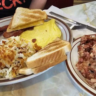 2 eggs, hash browns, bacon  and toast. With corned beef hash!