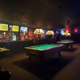 pool tables and neon signs