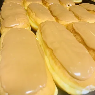 a tray of glazed donuts