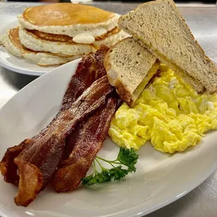 Simple eggs, bacon and toast. Added a full stack.