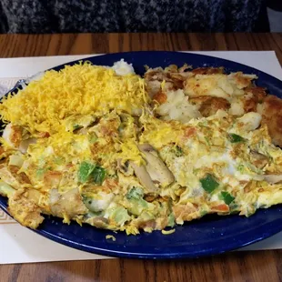 Veggie omelet wih both hashbrowns and cheese grits (50/50).