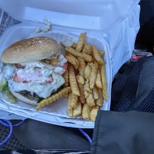 Slamming coleslaw lettuces, tomato and onion burger