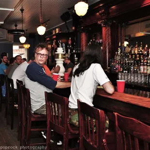 people sitting at the bar