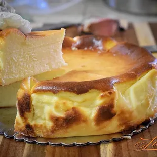 a cheesecake with a slice taken out of it